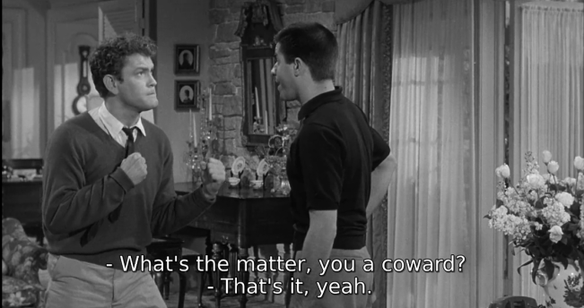 A screenshot from 'Visit to a Small Planet' (1960) showing dialogue: 'What's the matter, you a coward?' 'That's it, yeah.'