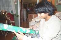  04-sumana-unwraps-present.jpg 